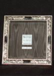 Click for full size image

All of our Sterling Silver frames have a tarnish resistant finish.